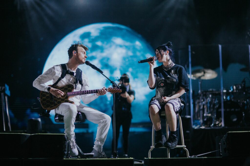 Billie Eilish and Finneas O'Connell on Coachella stage in Billie Eilish: The World's a Little Blurry documentary