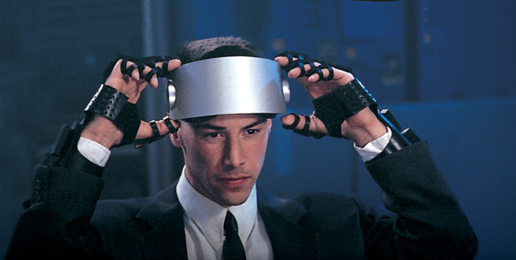 Keanu Reeves with silver goggles in 25th anniversary re-release of 1995 cyberpunk thriller Johnny Mnemonic